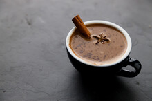Hot Chocolate With Cinnamon Stick In Blue Cup.