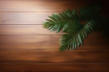 Wall Mural - Palm leaves on wooden background. Top view with copy space.