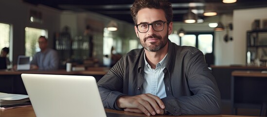 Leinwandbilder - Happy freelancer man enjoying remote work and self employment smiling at camera