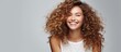 © HN Works - Smiling girl with curly hair joyfully White studio background