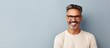 © HN Works - A joyful adult white man with a beard and glasses stands happily at home with room for text