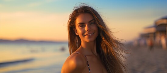 Wall Mural - Happy European woman in swimsuit smiling and posing at beach carefree lady walking on beach at sunset with room for text