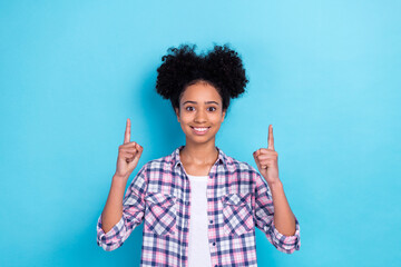 Sticker - Photo of adorable girl with perming coiffure dressed checkered shirt directing at sale empty space isolated on blue color background