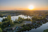 Fototapeta Fototapety na ścianę - Dolina rzeki Odra. Zachód słońca nad Polderem Buków na Śląsku w Polsce, panorama z lotu ptaka latem.