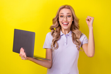 Poster - Photo of positive lucky lady wear purple polo spectacles winning game modern gadget isolated yellow color background