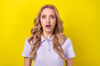 Portrait of speechless impressed person open mouth staring cant believe wear violet t-shirt isolated on yellow color background