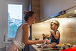 © Dragana Gordic - Happy family in the kitchen. Mother and son. Mom with her 2 years old child cooking. Casual lifestyle photo series in real life interior. Young mother and son in kitchen making cookies.