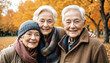 © Jenar - photo of three happy elderly friends woman posing in autumn park with leaf on heart, generative AI