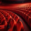 The empty, large auditorium of the cinema, its rows of vibrant red chairs standing in silent anticipation, fills the room with an inviting energy