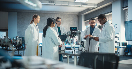 Fototapete - Diverse Team of Industrial Robotics Specialists Gathered Around a Table With a Mobile Robot. Engineers In Lab Coats Discussing an Automated AI Robotic Dog, Using Laptop and Tablet, Brainstorming