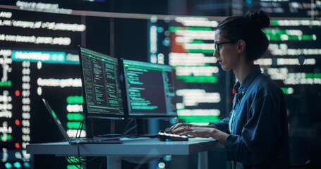 Poster - Female Developer Thinking and Typing on Computer, Surrounded by Big Screens Showing Coding Language. Professional Programmer Working in an Office, Running Coding Tests. Futuristic Programming