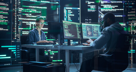 Fototapete - Portrait of Two Diverse Developers Working on Computer, Typing Lines of Code that Appear on Big Screens Surrounding Them. Male and Female Programmers Creating Innovative Software Together, Fixing Bugs