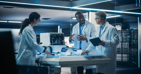 Fototapete - Diverse Team of Industrial Robotics Specialists Gathered Around Table With a Mobile Robot. Engineers In Lab Coats Discussing an Automated Robotic Delivery Assistant with Artificial Intelligence
