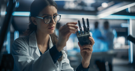 Poster - Young Scientist Working on a Bionic Robot Hand for People with Health Conditions or Impairments. Female Engineer Using a Screwdriver to Work on Humanoid AI Robot Component at a Startup Company