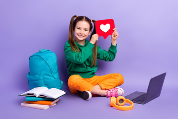 Canvas Print - Full length photo of pretty cute small girl wear green sweatshirt remote studying gadget rising heart isolated violet color background