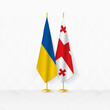 Ukraine and Georgia flags on flag stand, illustration for diplomacy and other meeting between Ukraine and Georgia.