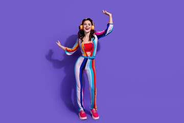 Sticker - Photo of positive cheerful excited lady listen rock pop song dancing isolated on vivid color background