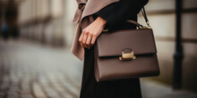 Close Up Of A Young Elegant Woman With A Brown Luxury Leather Handbag Standing On The Streets Of Copenhagen