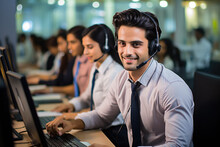 Indian Call Centre - Happy Male Customer Representative Communicating With Customer On Microphone