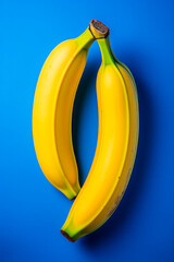 Poster - Fresh yellow bananas on blue background