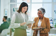 © Azee Jacobs/peopleimages.com - Internship, tablet or happy woman with mentor in discussion with notebook for news, business info or advice. Teamwork, laughing or Asian worker talking or learning data analytics in digital agency