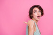 © deagreez - Side photo of young woman bob brown hair impressed reaction pointing finger empty space spring sale offer isolated on pink color background