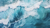 Fototapeta Łazienka - The powerful ocean waves from an aerial perspective. The white foam of the breaking waves, creating a stunning, frothy texture that conveys the ocean's energy and movement. Sea water in motion.