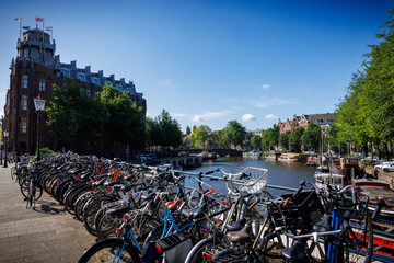 Bicycles in Amsterdam along canal, many