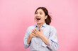 © Katcha - Young asian woman use both hands touching on the chest and open mouth while feeling shocked and scared
