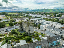 Aerial View Of Carlow Castle And Town In Ireland With Circular Towers Above The River Barrow
