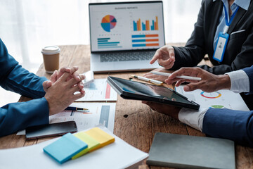 Aufkleber - Business team analyzing income charts and graphs with modern laptop computer. Close up.Business analysis and strategy concept.