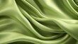 Waves of pea green satin fabric
