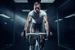 © Stavros - Sports to the max. Young muscular athlete during training on an exercise bike. Training the cardio system on a smart simulator. Electronic tracking for the most productive workout.