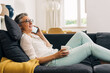 © cherryandbees - Side view of a mature woman having a conversation over the phone.