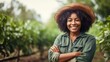 Black woman farmer in a hat at a farm