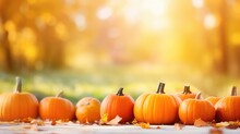 Defocused Colorful Bright Autumn Ultra Wide Panoramic Background With Blurry Pumpkins And Falling Autumn Leaves In The Park. Generative AI