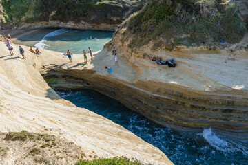 Poster - Afionas, Greece - June 19, 2021: Drone photo of Kanali tou Erota - Channel of Love in Sidari village