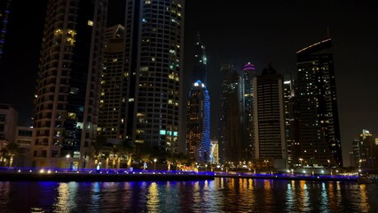 Wall Mural - Modern city in the night, Dubai Marina view in the night. High quality 4k footage