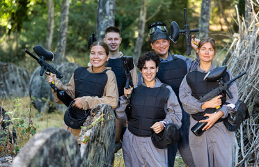 Canvas Print - Happy men and women share their impressions of playing paintball