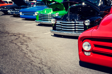 Wall Mural - Vintage cars in a row at a car show on the street