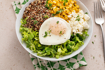 Wall Mural - Breakfast bowl with quinoa, herbed corn, feta cheese and fried egg