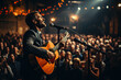 © PaulShlykov - Popular country music performer with a guitar on a big stage under spotlights