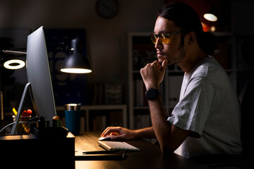 Aufkleber - Asian man graphic designer working on computer drawing sketches logo design. The concept of a new brand. Professional creative occupation with idea..