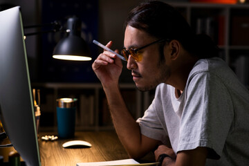 Aufkleber - Asian man graphic designer working on computer drawing sketches logo design. The concept of a new brand. Professional creative occupation with idea.