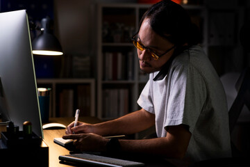Aufkleber - Asian man graphic designer working on computer drawing sketches logo design. The concept of a new brand. Professional creative occupation with idea.