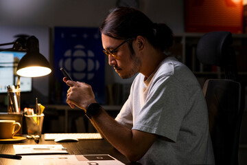 Aufkleber - Asian man graphic designer working on computer drawing sketches logo design. The concept of a new brand. Professional creative occupation with idea.
