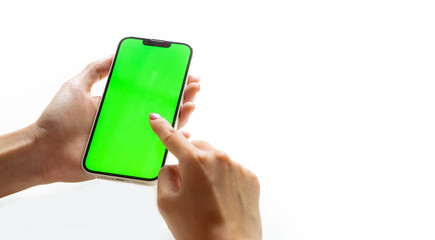 Poster - Mockup image, woman holding black smartphone and finger pointing on blank green screen isolated white background.