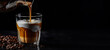 Coffee with pouring milk in glass on dark background copy space 