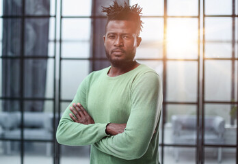 Portrait of a happy African American entrepreneur in office