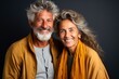 © XC Stock - happy mature couple smiling smiling isolated on dark background,
